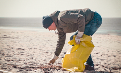Man cleaning up the beach